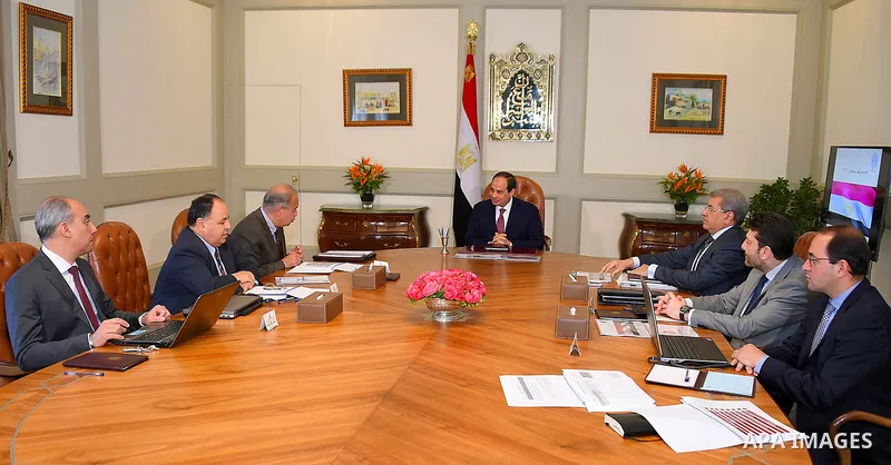 Egyptian President Abdel Fattah al-Sisi meets with Sherif Ismail Prime Minister, and Minister of Finance Amr El Garhy in Cairo, Egypt, on April 18, 2017. Photo by Egyptian President Office