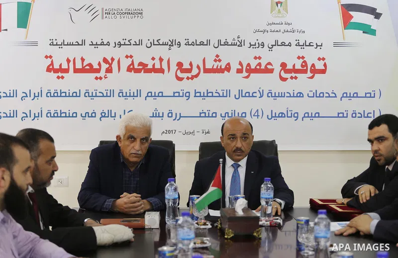 Palestinian housing minister Mufeed al-Hasayna, attends a signing ceremony of Italian grant projects in Gaza city on April 20, 2017. Photo by Mohammed Asad