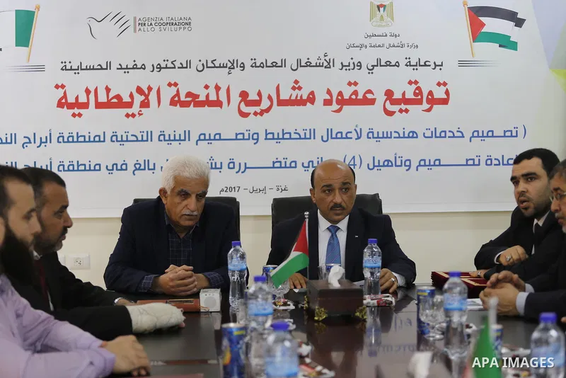 Palestinian housing minister Mufeed al-Hasayna, attends a signing ceremony of Italian grant projects in Gaza city on April 20, 2017. Photo by Mohammed Asad