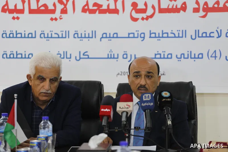 Palestinian housing minister Mufeed al-Hasayna, attends a signing ceremony of Italian grant projects in Gaza city on April 20, 2017. Photo by Mohammed Asad