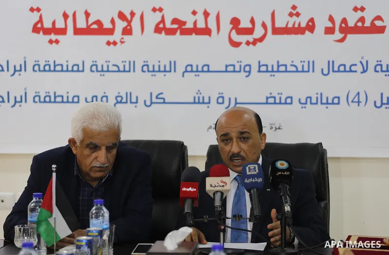 Palestinian housing minister Mufeed al-Hasayna, attends a signing ceremony of Italian grant projects in Gaza city on April 20, 2017. Photo by Mohammed Asad