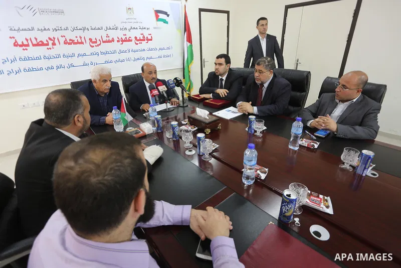 Palestinian housing minister Mufeed al-Hasayna, attends a signing ceremony of Italian grant projects in Gaza city on April 20, 2017. Photo by Mohammed Asad