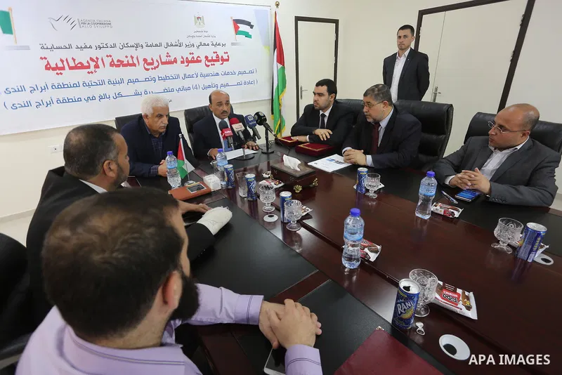 Palestinian housing minister Mufeed al-Hasayna, attends a signing ceremony of Italian grant projects in Gaza city on April 20, 2017. Photo by Mohammed Asad