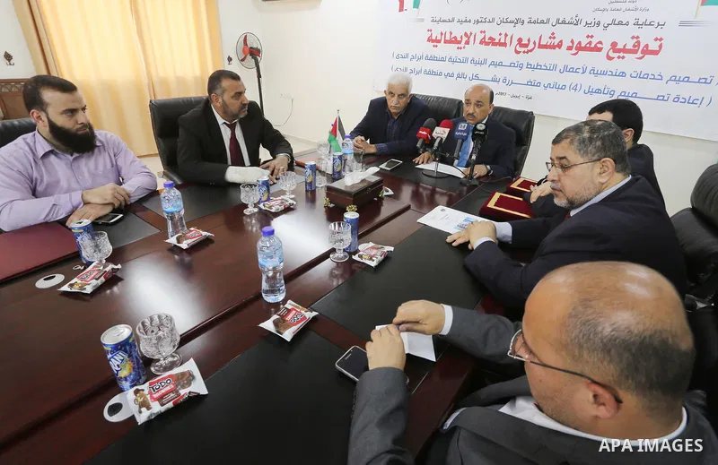 Palestinian housing minister Mufeed al-Hasayna, attends a signing ceremony of Italian grant projects in Gaza city on April 20, 2017. Photo by Mohammed Asad