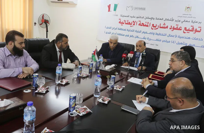 Palestinian housing minister Mufeed al-Hasayna, attends a signing ceremony of Italian grant projects in Gaza city on April 20, 2017. Photo by Mohammed Asad