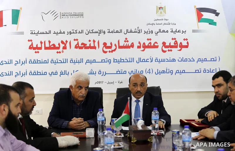 Palestinian housing minister Mufeed al-Hasayna, attends a signing ceremony of Italian grant projects in Gaza city on April 20, 2017. Photo by Mohammed Asad