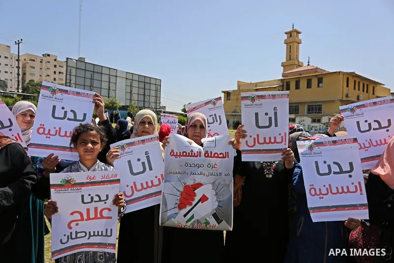 Palestinian Cancer patients take part in a protest to demand to travel for treatment, in Gaza city, on April 20, 2017. Photo by Ashraf Amra