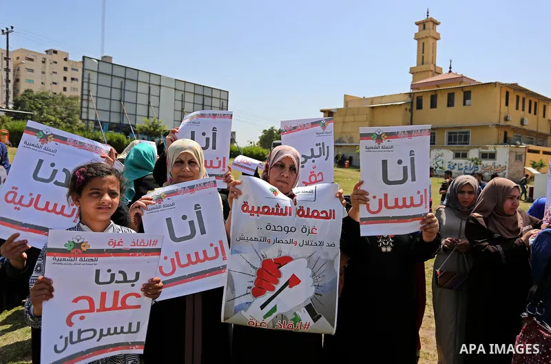 Palestinian Cancer patients take part in a protest to demand to travel for treatment, in Gaza city, on April 20, 2017. Photo by Ashraf Amra