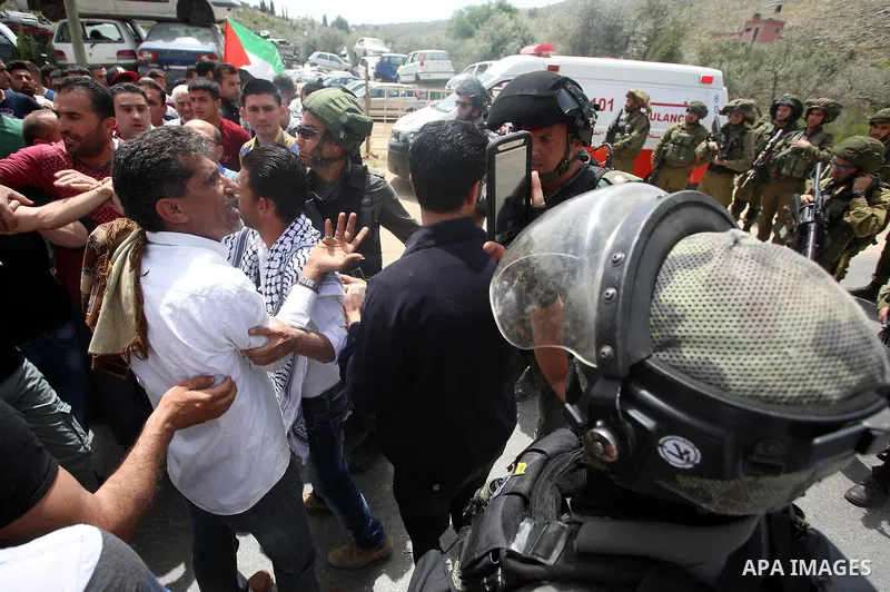 Israeli soldiers clash with Plestinian protesters during a demonstration following Friday prayers in solidarity with Palestinian prisoners on hunger strike in Israeli jails, in the West Bank village of Beita, southeast o...
