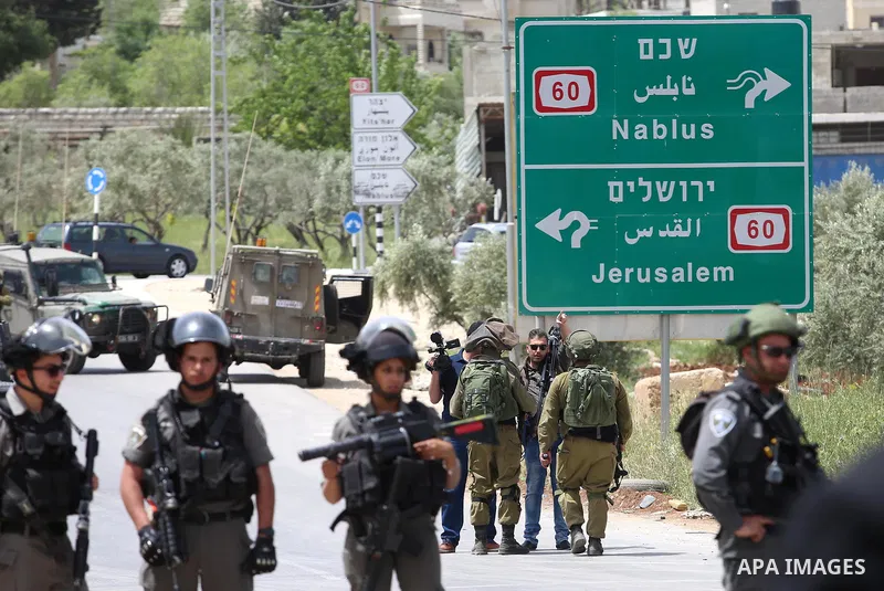 Israeli soldiers take position during a demonstration following Friday prayers in solidarity with Palestinian prisoners on hunger strike in Israeli jails, in the West Bank village of Beita, southeast of Nablus city on Ap...