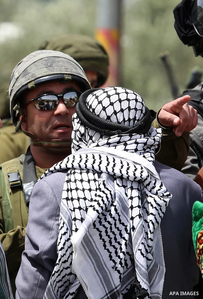 Israeli soldiers clash with Plestinian protesters during a demonstration following Friday prayers in solidarity with Palestinian prisoners on hunger strike in Israeli jails, in the West Bank village of Beita, southeast o...