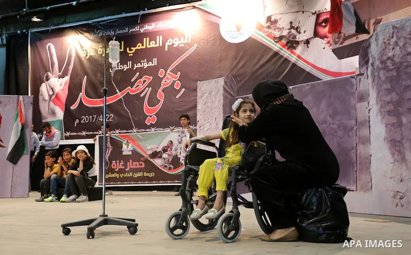 Palestinians perform during an operetta titled "enough blockade" on the International day in support of Gaza, in Gaza city on April 22, 2017. Photo by Ashraf Amra