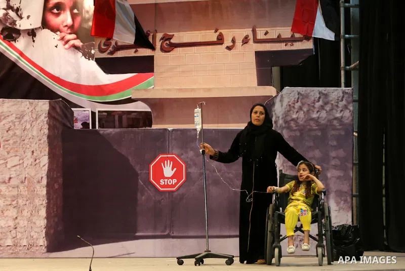 Palestinians perform during an operetta titled "enough blockade" on the International day in support of Gaza, in Gaza city on April 22, 2017. Photo by Ashraf Amra