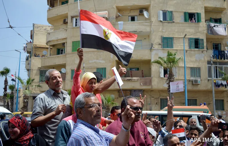Mona El Sayed, an Egyptian woman known in media as "girl cart" holds an Egypitan national flag before she receives a mini-bus which was funded by “Tahya Masr” (Long Live Egypt) fund in Cairo, Egypt, on April 22, 2017. Ju...