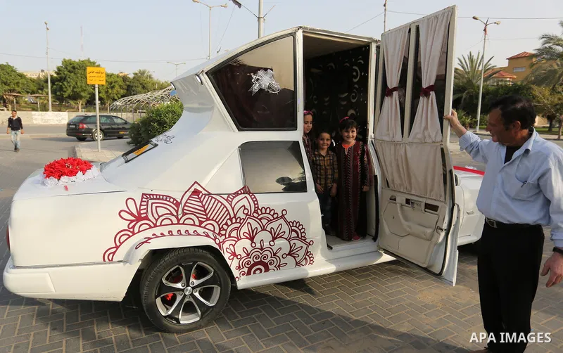 A Palestinian mechanic display his "Cinderella" vehicle in Gaza City on April 22, 2017. Made up of five different cars, it will be rented out for use at marriage ceremonies. Photo by Ashraf Amra