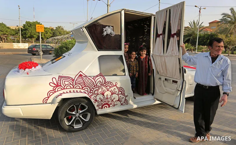 A Palestinian mechanic display his "Cinderella" vehicle in Gaza City on April 22, 2017. Made up of five different cars, it will be rented out for use at marriage ceremonies. Photo by Ashraf Amra