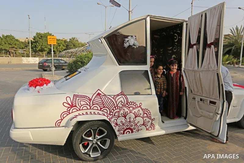 A Palestinian mechanic display his "Cinderella" vehicle in Gaza City on April 22, 2017. Made up of five different cars, it will be rented out for use at marriage ceremonies. Photo by Ashraf Amra