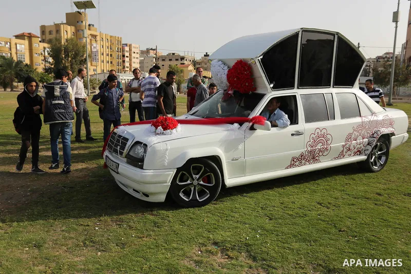 A Palestinian mechanic display his "Cinderella" vehicle in Gaza City on April 22, 2017. Made up of five different cars, it will be rented out for use at marriage ceremonies. Photo by Ashraf Amra