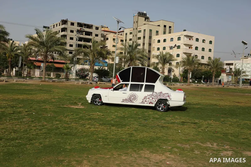 A Palestinian mechanic display his "Cinderella" vehicle in Gaza City on April 22, 2017. Made up of five different cars, it will be rented out for use at marriage ceremonies. Photo by Ashraf Amra