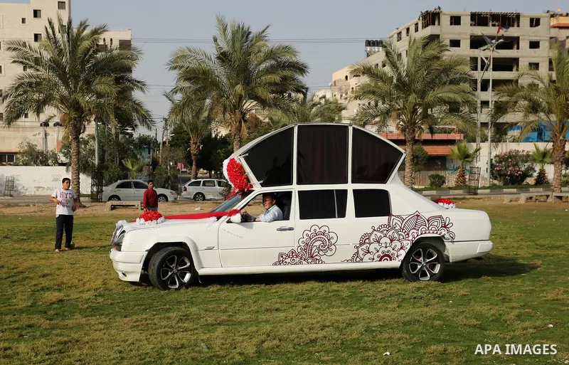 A Palestinian mechanic display his "Cinderella" vehicle in Gaza City on April 22, 2017. Made up of five different cars, it will be rented out for use at marriage ceremonies. Photo by Ashraf Amra