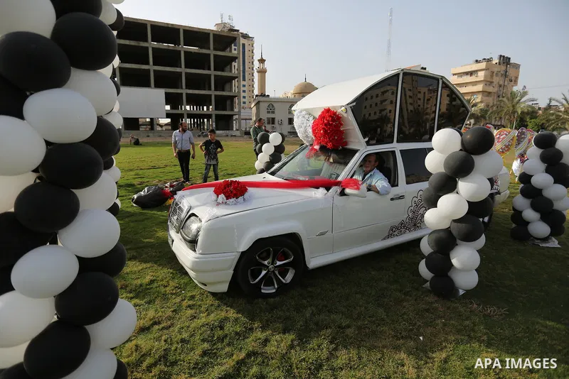 A Palestinian mechanic display his "Cinderella" vehicle in Gaza City on April 22, 2017. Made up of five different cars, it will be rented out for use at marriage ceremonies. Photo by Ashraf Amra