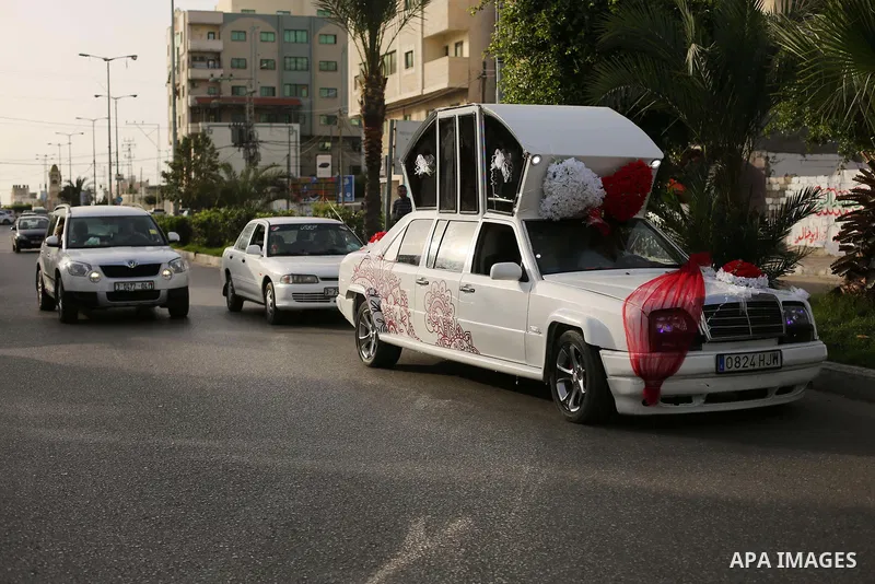 A Palestinian mechanic display his "Cinderella" vehicle in Gaza City on April 22, 2017. Made up of five different cars, it will be rented out for use at marriage ceremonies. Photo by Ashraf Amra