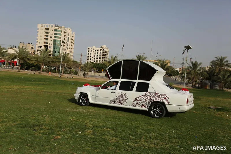 A Palestinian mechanic display his "Cinderella" vehicle in Gaza City on April 22, 2017. Made up of five different cars, it will be rented out for use at marriage ceremonies. Photo by Ashraf Amra