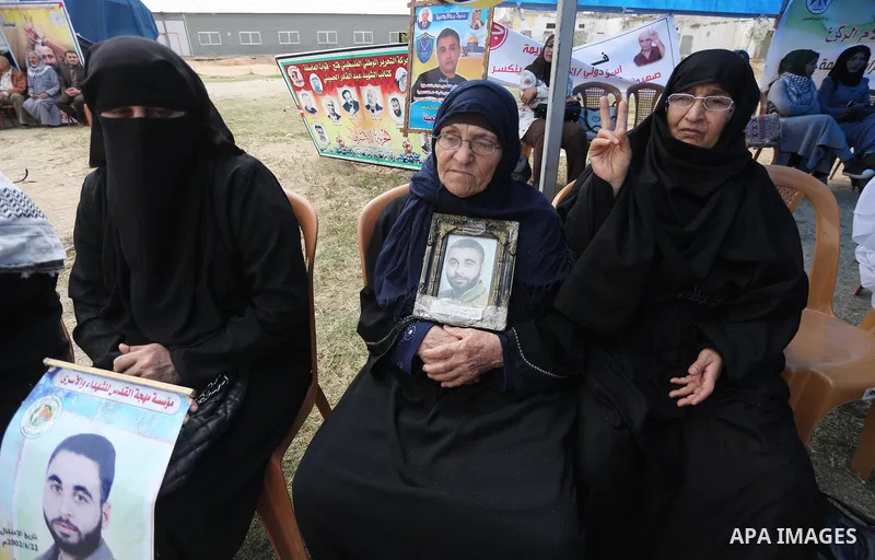 Palestinian protesters hold banners during a protest in solidarity with Palestinian prisoners on hunger strike in Israeli jails, in Gaza city on April 24, 2017. Some 1,500 Palestinian prisoners have joined the hunger str...