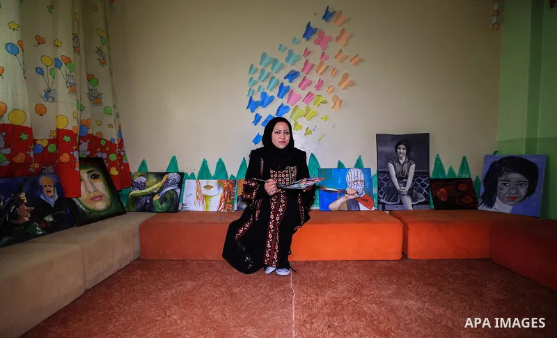 Hana Hamsh, a Palestinian artist ,27, paints artwork at her atelier in Gaza city on Feb. 15, 2017. Hamsh work at a teacher for draw and participated in more than 40 exhibitions and murals at the local and international....