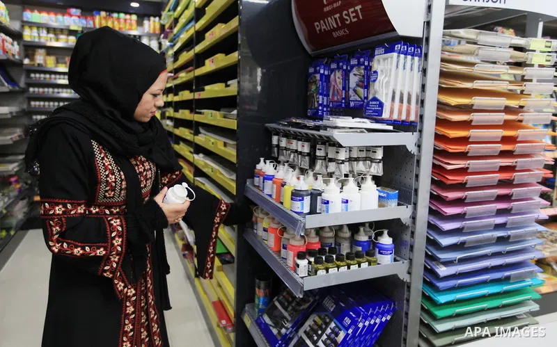 Hana Hamsh, a Palestinian artist ,27, buys special tools and colors for drawing in Gaza city on Feb. 15, 2017. Hamsh work at a teacher for draw and participated in more than 40 exhibitions and murals at the local and int...