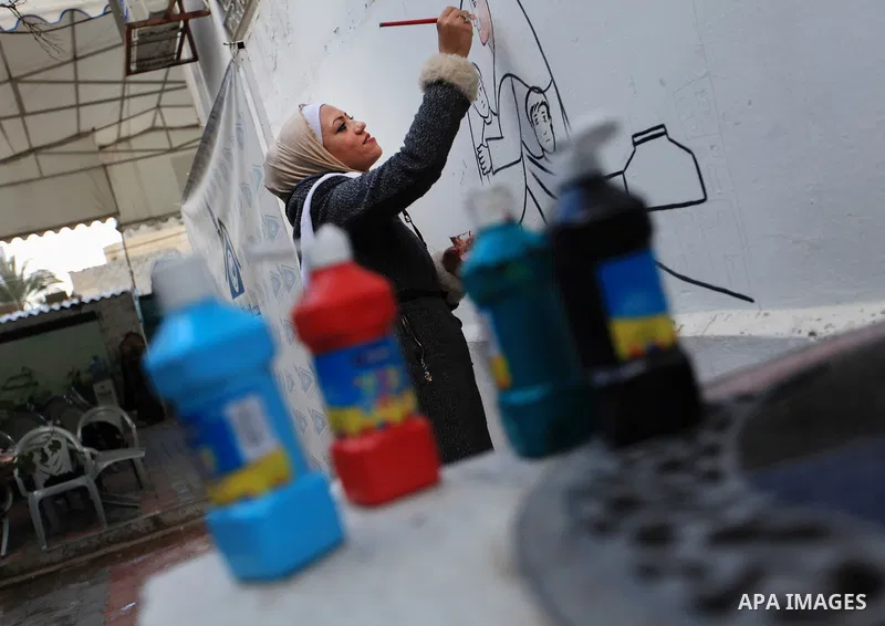 Hana Hamsh, a Palestinian artist ,27, paints artwork at her atelier in Gaza city on Feb. 15, 2017. Hamsh work at a teacher for draw and participated in more than 40 exhibitions and murals at the local and international....