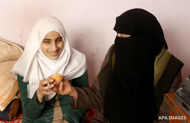 Asmaa Abu Hilal,18, a Palestinian blind student eats at her family house in Rafah in the southern Gaza strip on Feb. 14, 2017. Abu Hilal superior at her study although there are no private schools for the blind in the ci...