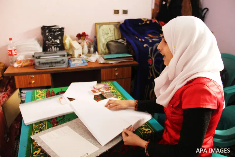 Asmaa Abu Hilal,18, a Palestinian blind student reads a copy of the holy Koran in braille at her family house in Rafah in the southern Gaza strip on Feb. 14, 2017. Abu Hilal superior at her study although there are no pr...
