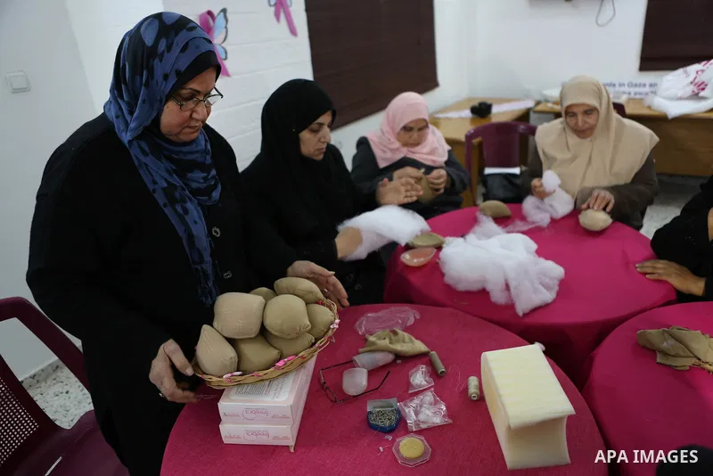 Aisha al-Baroud, 44, a Palestinian woman with breast cancer and her colleagues make artificial breasts for mastectomy survivors for free, in the northern Gaza stirp on Feb. 13, 2017. Al-Baroud with breast cancer for more...