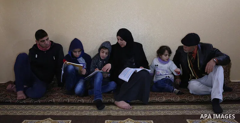 Aisha al-Baroud, 44, a Palestinian woman with breast cancer teaches her children in the northern Gaza stirp on Feb. 13, 2017. al-Baroud with breast cancer for more three years makes artificial breasts for mastectomy surv...