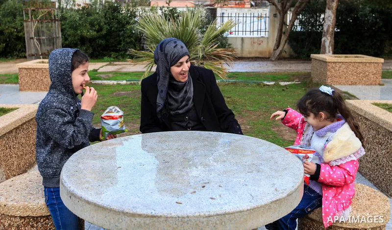 Aisha al-Baroud, 44, a Palestinian woman with breast cancer plays with her children in the northern Gaza stirp on Feb. 13, 2017. al-Baroud with breast cancer for more three years makes artificial breasts for mastectomy s...