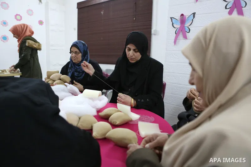 Aisha al-Baroud, 44, a Palestinian woman with breast cancer and her colleagues make artificial breasts for mastectomy survivors for free, in the northern Gaza stirp on Feb. 13, 2017. Al-Baroud with breast cancer for more...