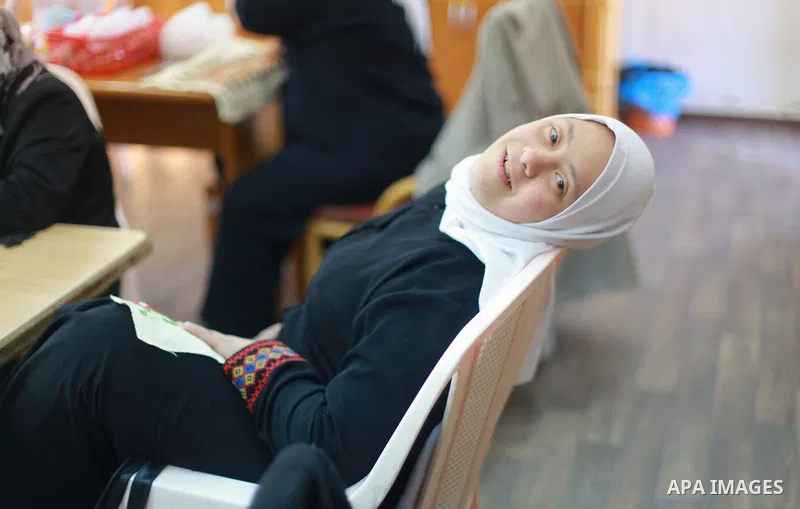 Iman al-Tanani, a 28-year-old a Palestinian woman with Down syndrome works on embroidery in Gaza city on Feb. 16, 2017. al-Tanani got work from United Nations Relief and Works Agency (UNRWA) on handmade, moreover she pla...