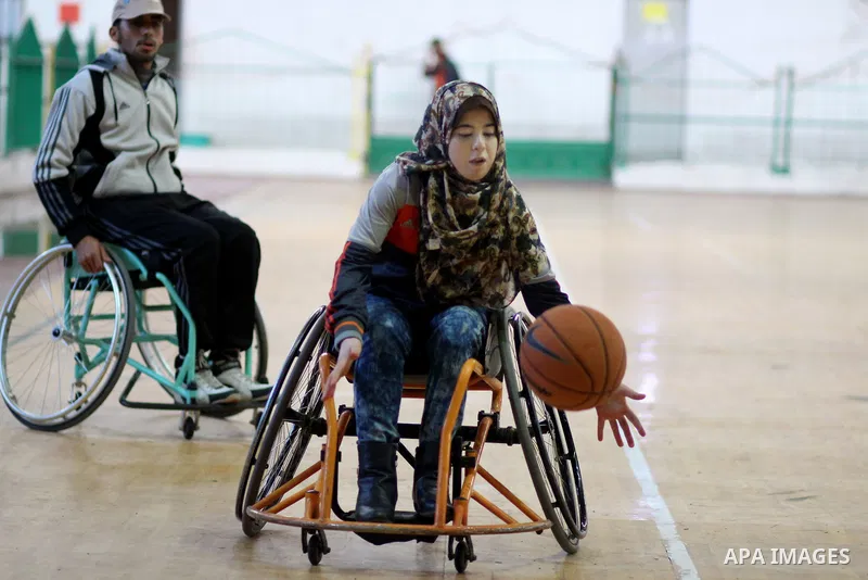 Disabled Palestinians take part in a training course to play basketball at al-Jazeera club in Gaza city on April 12, 2017. Disabled Palestinians from al-Jazeera club got many medals on thier participate in international...