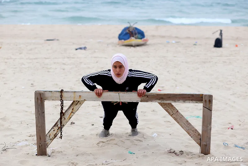 Dania El Masry, 20-years old a Palestinian woman from Khan younis student of Physical Therapy, plays CrossFit sport on the beach in the southern Gaza strip, on Feb. 07, 2017. CrossFit workouts incorporate elements from h...