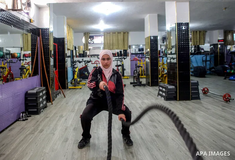 Dania El Masry, 20-years old a Palestinian woman from Khan younis student of Physical Therapy, plays CrossFit sport at Gym in the southern Gaza strip, on Feb. 07, 2017. CrossFit workouts incorporate elements from high-in...
