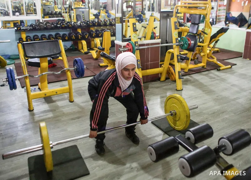 Dania El Masry, 20-years old a Palestinian woman from Khan younis student of Physical Therapy, plays CrossFit sport at Gym in the southern Gaza strip, on Feb. 07, 2017. CrossFit workouts incorporate elements from high-in...