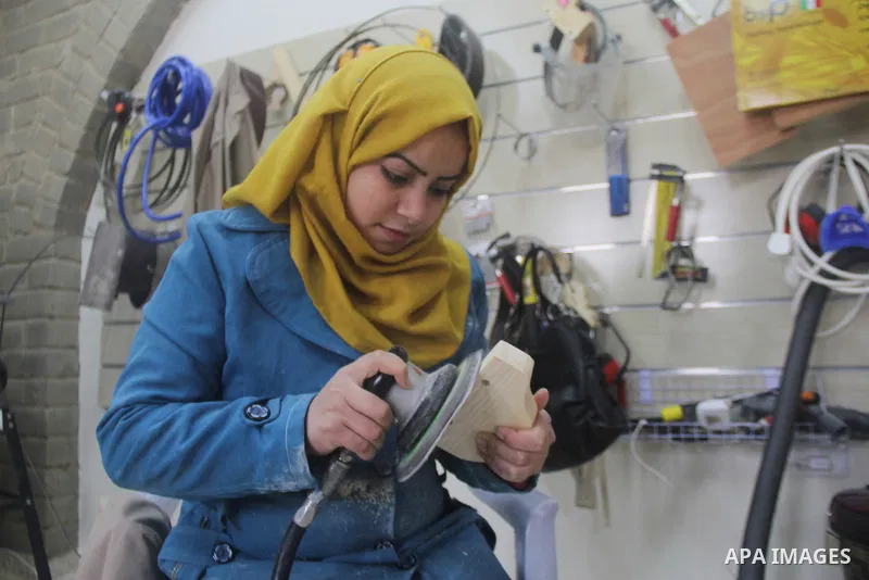 Ghadir Tayeh, 26, a Palestinian woman works at a carpentry in Beit Lahia in the northern Gaza strip on Feb. 14, 2017. Tayeh works on carpentry alongside with another 8 woman to help their husbands as the Israeli blockade...