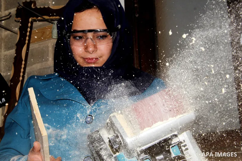 Ghadir Tayeh, 26, a Palestinian woman works at a carpentry in Beit Lahia in the northern Gaza strip on Feb. 14, 2017. Tayeh works on carpentry alongside with another 8 woman to help their husbands as the Israeli blockade...