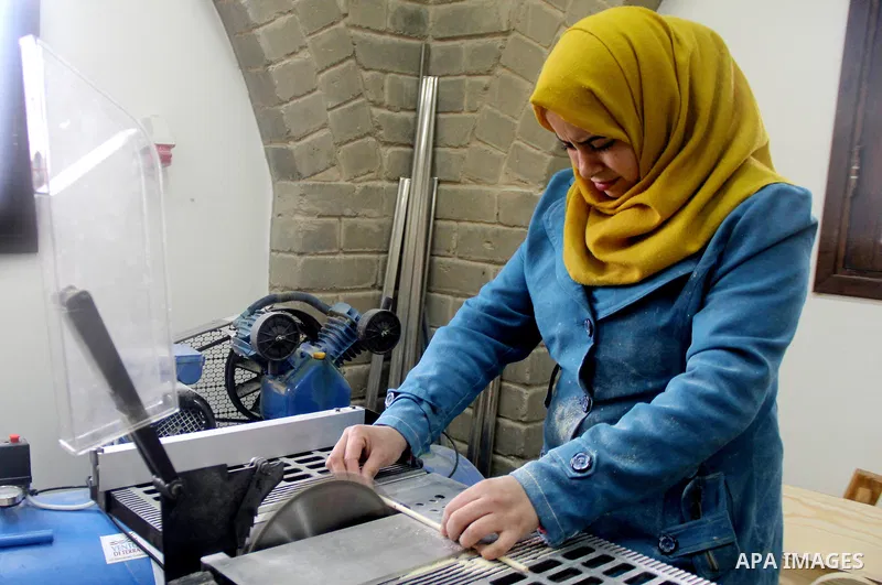 Ghadir Tayeh, 26, a Palestinian woman works at a carpentry in Beit Lahia in the northern Gaza strip on Feb. 14, 2017. Tayeh works on carpentry alongside with another 8 woman to help their husbands as the Israeli blockade...