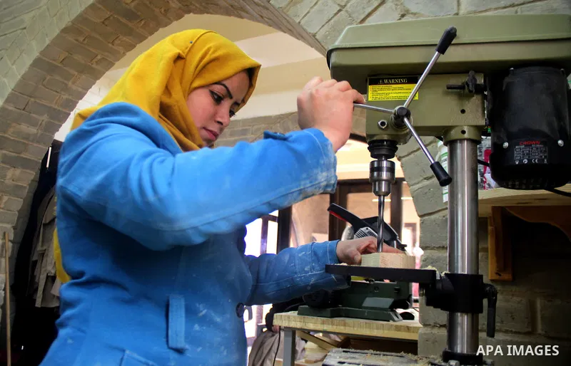 Ghadir Tayeh, 26, a Palestinian woman works at a carpentry in Beit Lahia in the northern Gaza strip on Feb. 14, 2017. Tayeh works on carpentry alongside with another 8 woman to help their husbands as the Israeli blockade...