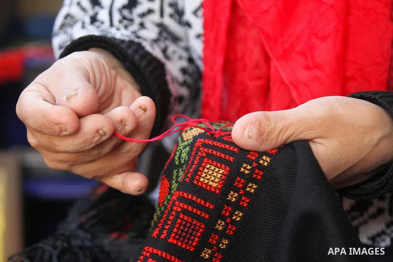 Sawsan Al Khalili, 40 years-old, a Palestinian woman of special needs works on embroidery in Gaza city on Feb. 11, 2017. Al Khalili secretary general of the general union of the Palestinian disabled and a head of the Pal...