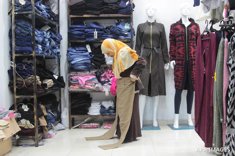 Sawsan Al Khalili, 40 years-old, a Palestinian woman of special needs visits clothes market in Gaza city on Feb. 11, 2017. Al Khalili secretary general of the general union of the Palestinian disabled and a head of the P...