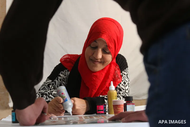 Sawsan Al Khalili, 40 years-old, a Palestinian woman of special needs paints in Gaza city on Feb. 11, 2017. Al Khalili secretary general of the general union of the Palestinian disabled and a head of the Palestinian fars...