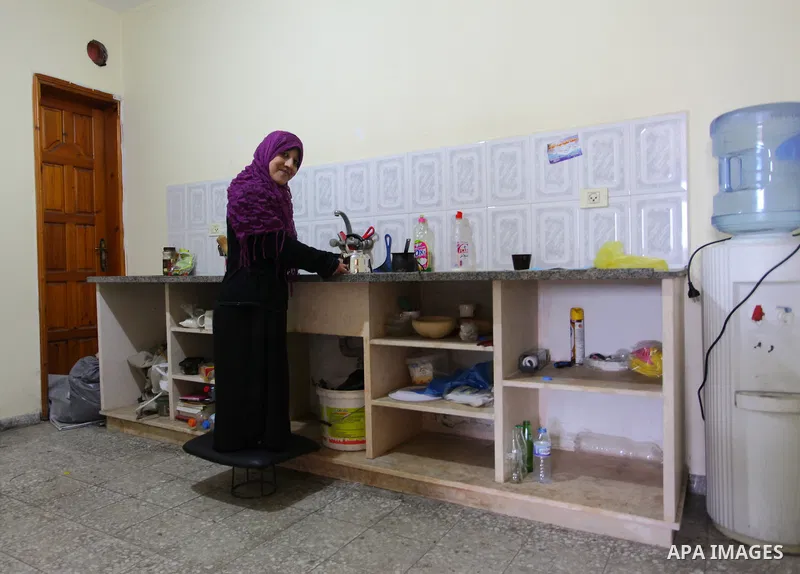 Sawsan Al Khalili, 40 years-old, a Palestinian woman of special needs prepares tea at her house in Gaza city on Feb. 11, 2017. Al Khalili secretary general of the general union of the Palestinian disabled and a head of t...